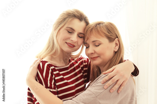 Happy young woman and her m...