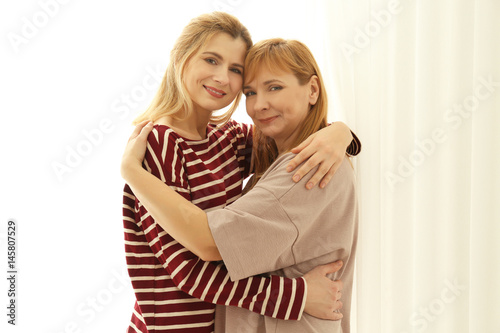 Happy young woman and her m...