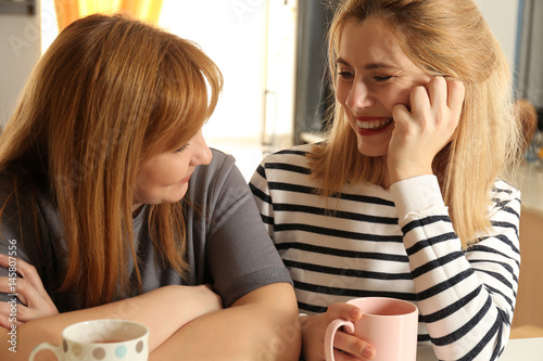 Happy young woman and her m...