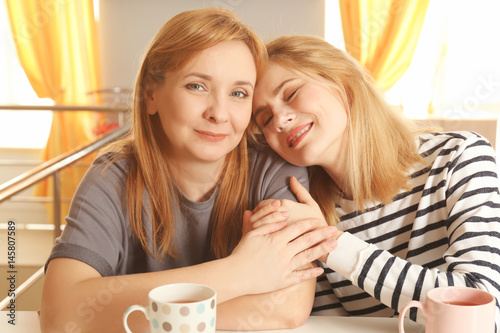 Happy young woman and her m...