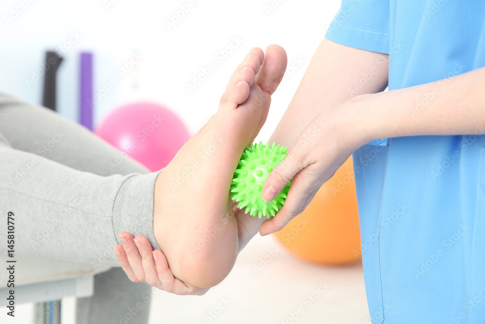 Orthopedist working with patient in clinic, closeup Orthopedist working with patient in clinic, closeup