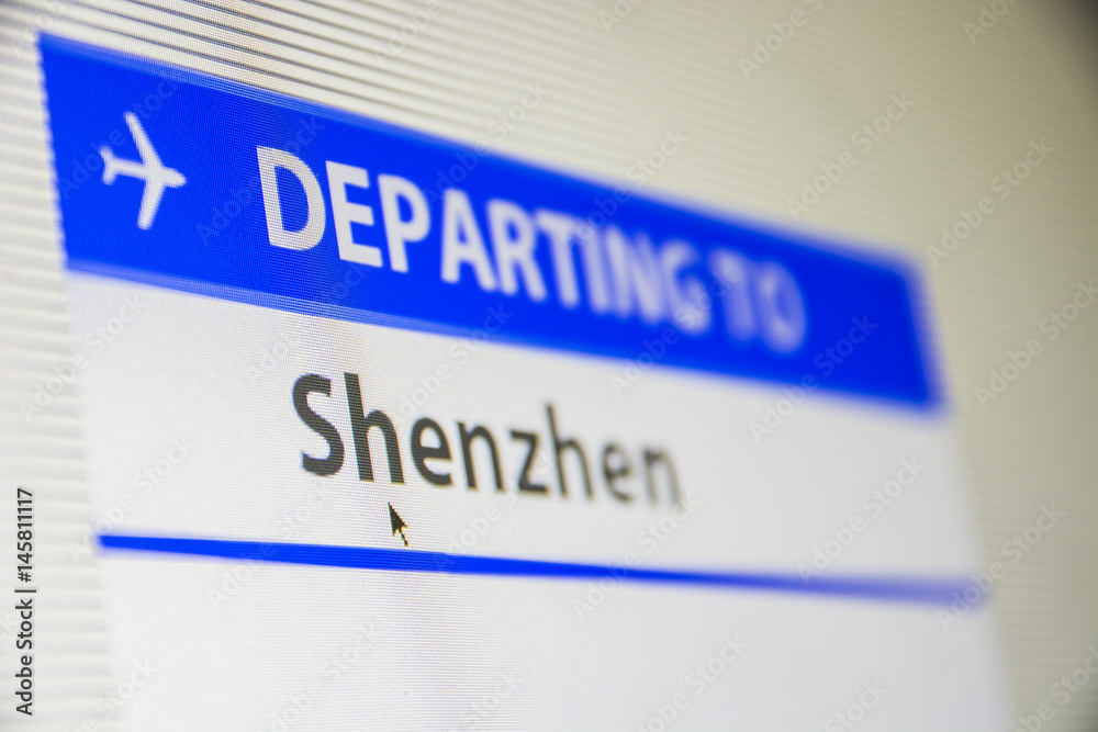 Computer screen close-up of status of flight departing to Shenzen, China Computer screen close-up of status of flight departing to Shenzen, China