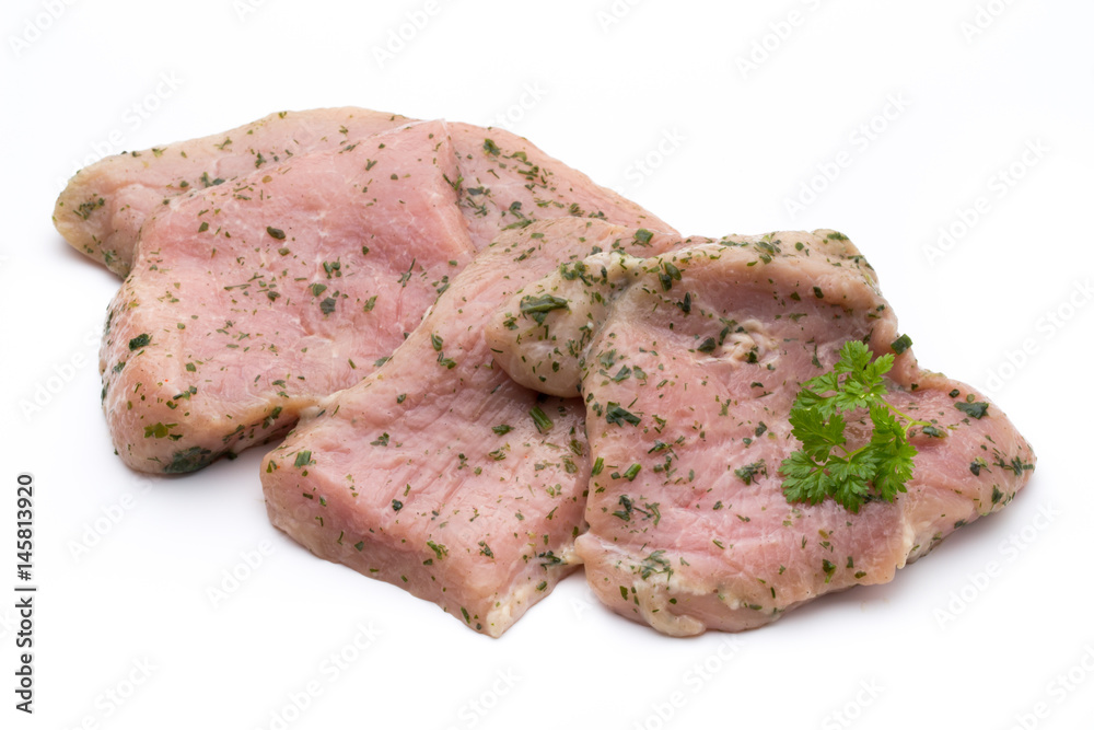 Steak with spices isolated on white background.