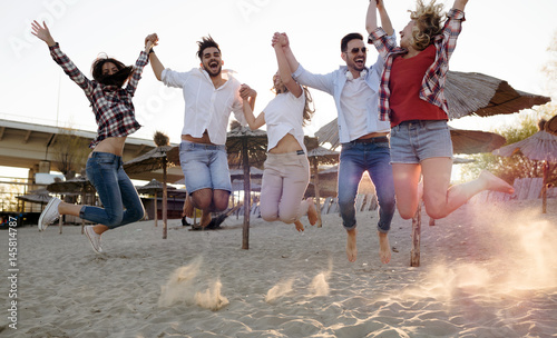 Group of happy young people enjoying summer vacation