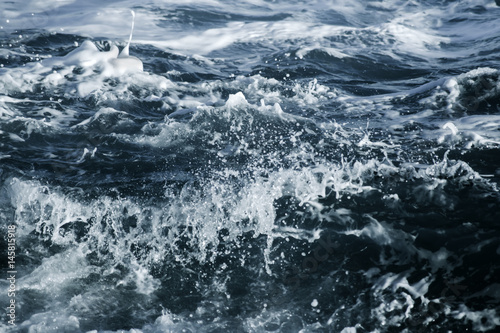 Big stormy ocean wave. Blue water background © Ivan Kurmyshov