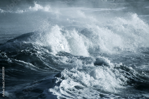 Big stormy ocean wave. Blue water background photo