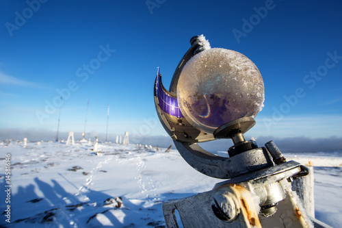 Campbell-Stokes sunshine recorder near meteorological station at winter photo