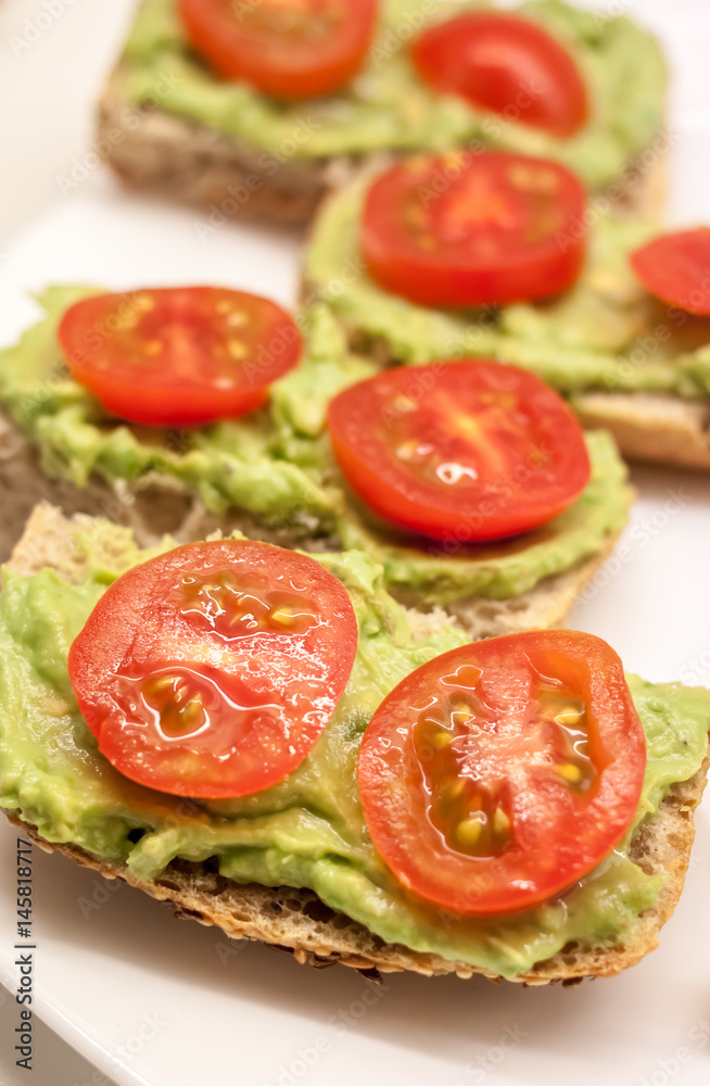 healthy sandwiches with guacamole and tomato