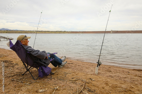 senior fisherman at the lake