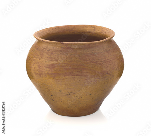 Clay handmade jug for cooking in the oven isolated on a white background