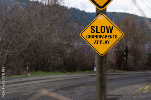 Fototapeta Naklejka Na Ścianę i Meble -  Slow Grandparents At Play Caution Sign
