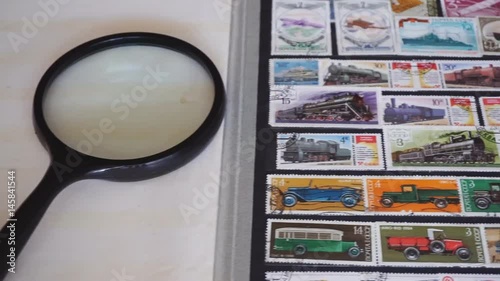 Stamp collecting. Collection of postage stamps. Postage stamp collecting album photo