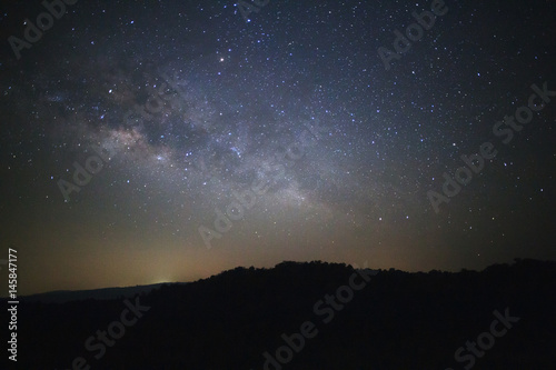 Milky way galaxy with stars over moutain at Phu Hin Rong Kla National Park Phitsanulok Thailand  Long exposure photograph.with grain