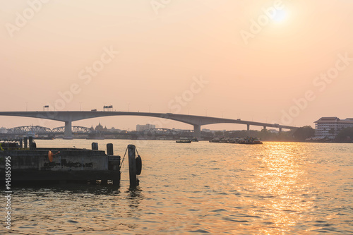 Photography silhouette of Bridge across the Chapraya  River at sunset