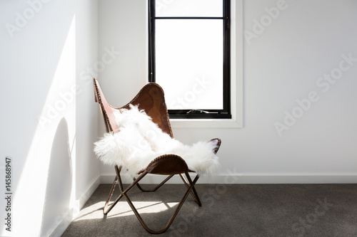 Gorgeous leather occasional chair with scandi style sheepskin