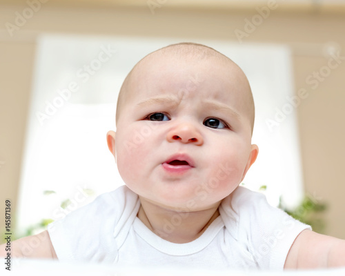 Newborn baby girl on her blanket