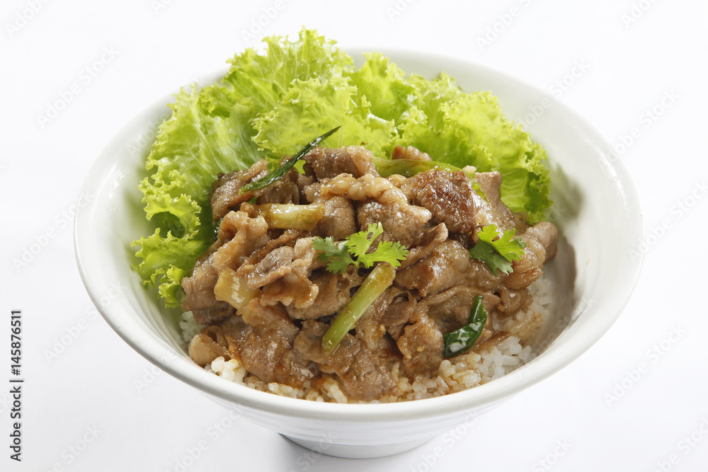 Fried rice with sauteed pork and lettuce on white background Fried rice with sauteed pork and lettuce on white background