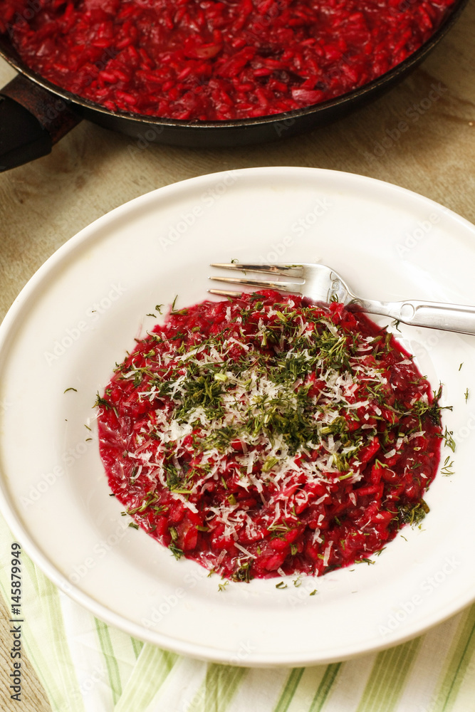 Red tomatoes sauce with minced herbs on white platter