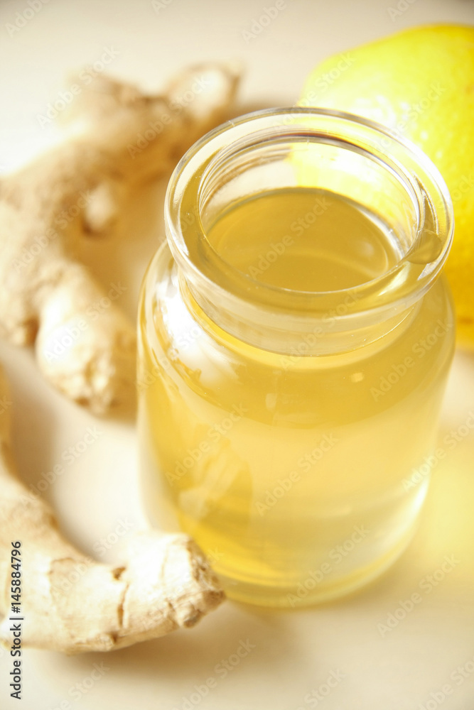Ginger syrup with orange in glass bottle Ginger syrup with orange in glass bottle