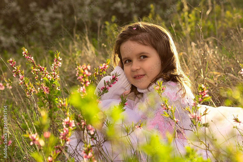 Little girl with spring flowers in nature Little girl with spring flowers in nature