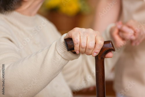 Woman holding a cane