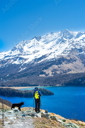 Girl in hiking mountain with her faithful dog