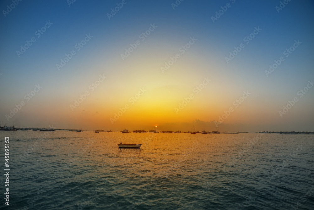 Sunset small boat