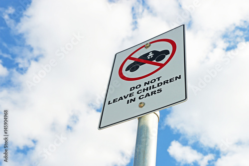 red, black and white Do Not Leave Children In Cars sign