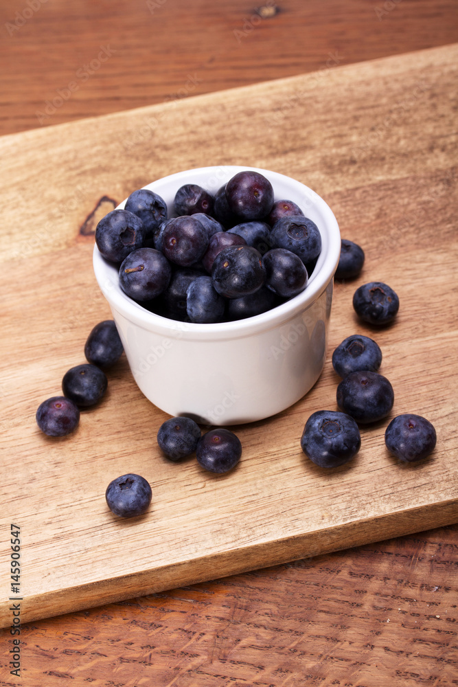 Pot of blueberries on a rustic background Pot of blueberries on a rustic background