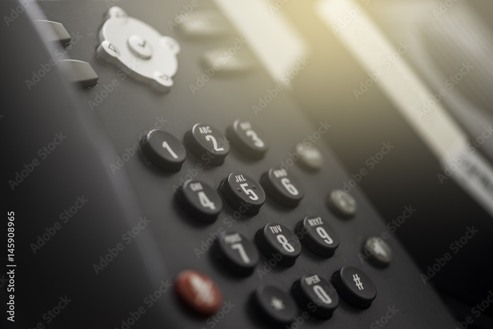 Set of black telephones on a desk, receiver close-up. Set of black telephones on a desk, receiver close-up.