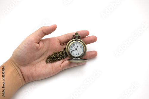 women of hand holding old silver pocket watch on white background, this image for people and retro concept