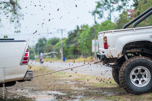 Pulls the cars out of the mud in Thailand.- (Selective focus)