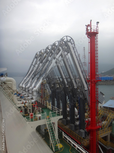 Photography LNG loading arms for load/discharge LNG cargo of liquefied natural gas tanker