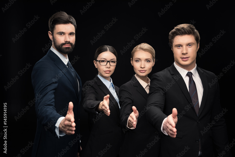 business team stretching out hands for shaking isolated on black, business establishment concept business team stretching out hands for shaking isolated on black, business establishment concept
