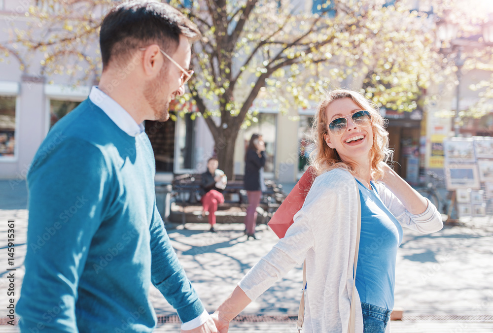 Handsome young couple in shopping. Consumerism, fashion, lifesty