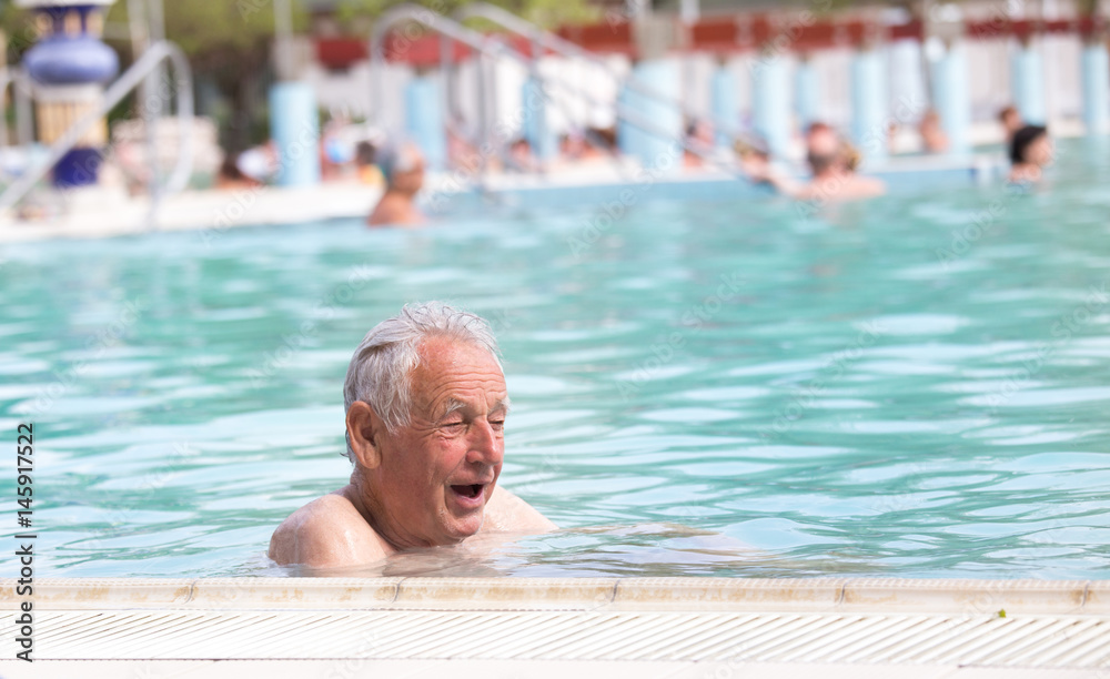 Fototapeta premium Senior man in swimming pool