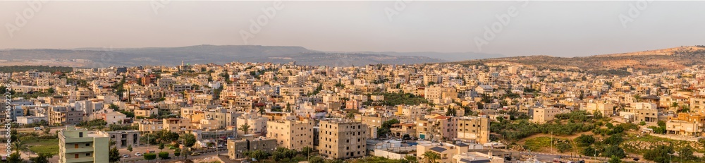 I'billin is an Arab town in the Northern District of Israel, near Shefa-'Amr.  The town has a mixed population of Muslims and Christians.