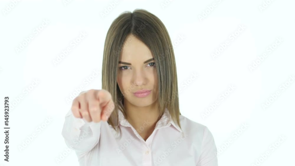 Beautiful Woman Pointing toward Camera, White Background Beautiful Woman Pointing toward Camera, White Background
