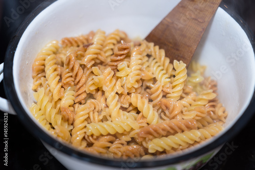 Italian fusilli pasta homemade cooked boiled in a saucepan