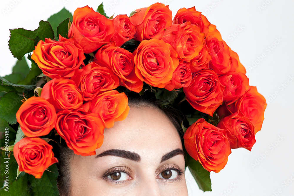 Portrait of the laughing red-haired girl with orange roses Portrait of the laughing red-haired girl with orange roses