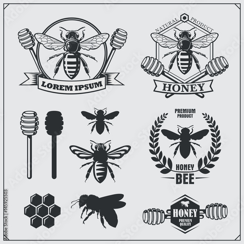 Set of honey labels, badges and design elements. Honeycombs, bee silhouettes, honey emblems.