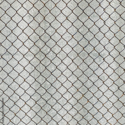 Rusry metal grid on the background of gray slate.
