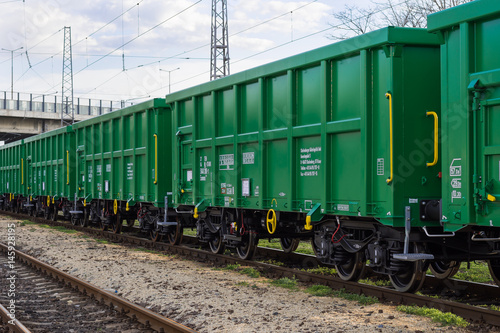 Burgas, Bulgaria - March 20, 2017 - Freight cargo train - 4axled box wagon green Type:Eanos Model:155-1 - Transvagon AD