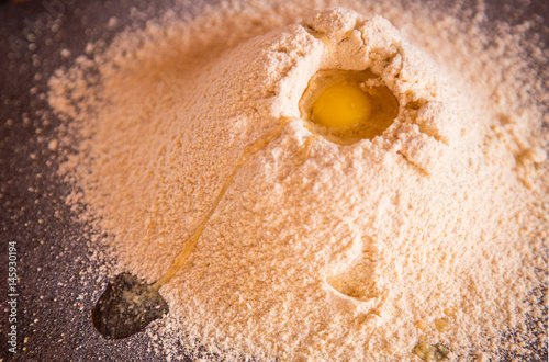 broken egg in the flour