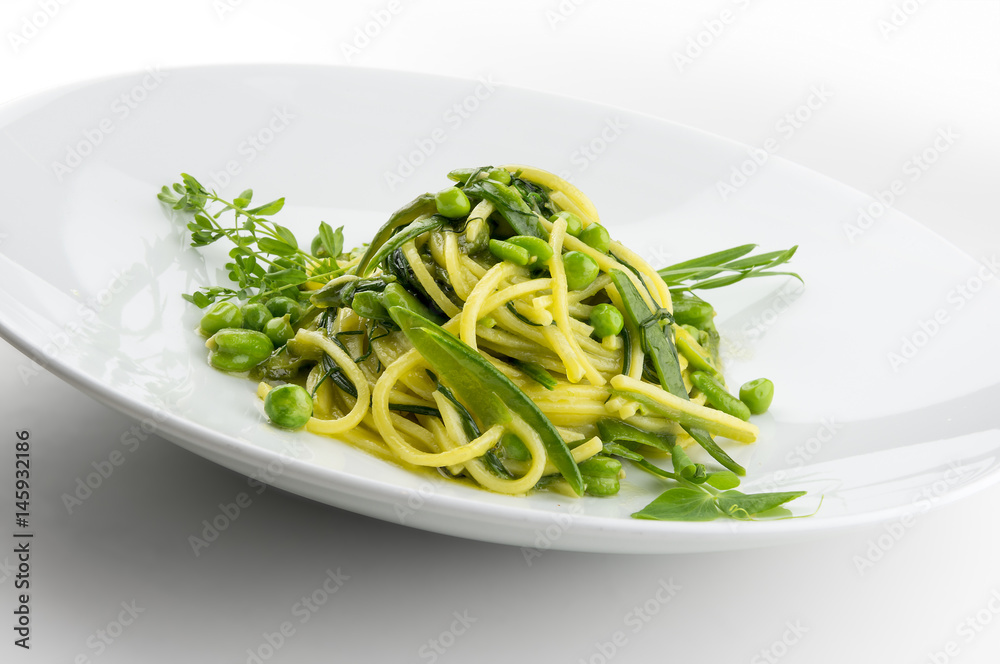 Pasta dish spaghetti with herbs and spring veggies Pasta dish spaghetti with herbs and spring veggies