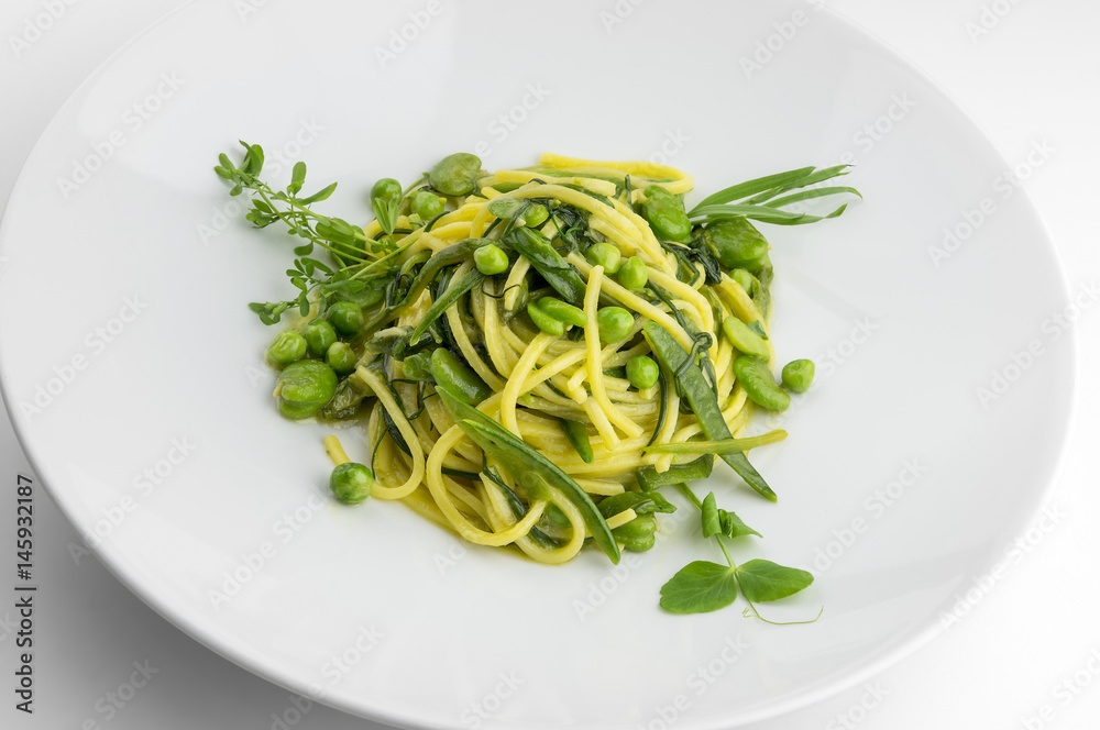 Pasta dish spaghetti with herbs and spring veggies Pasta dish spaghetti with herbs and spring veggies