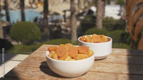 Apricot: orange fresh apricots on a pool terrace photo