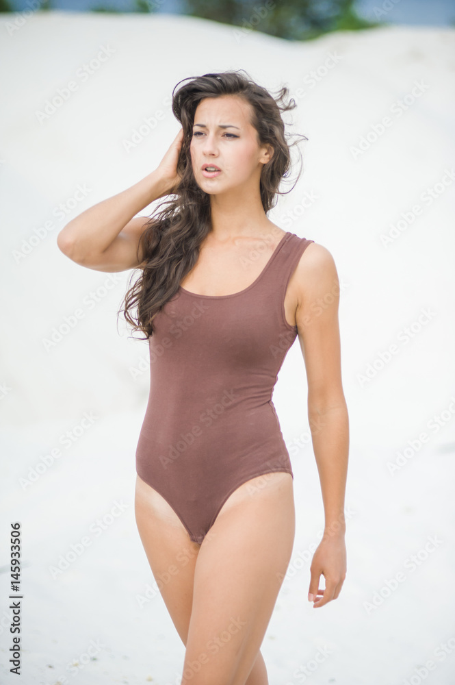 Fitness beautiful slim girl with brown hair posing Fitness beautiful slim girl with brown hair posing