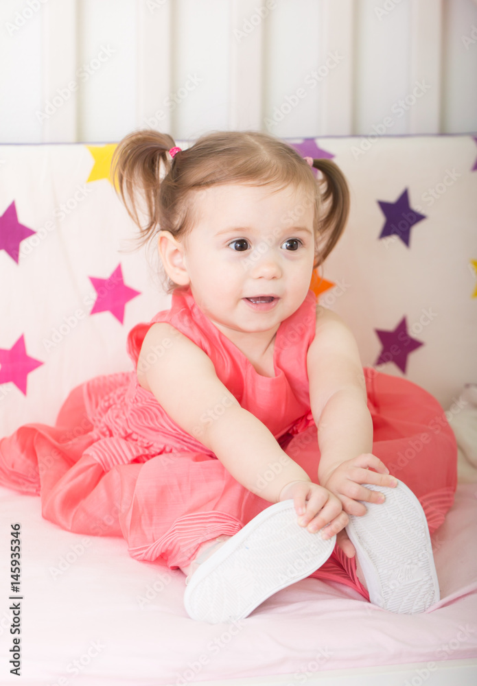 Cuteness.Happy little girl at studio with pink princesse dress Cuteness.Happy little girl at studio with pink princesse dress