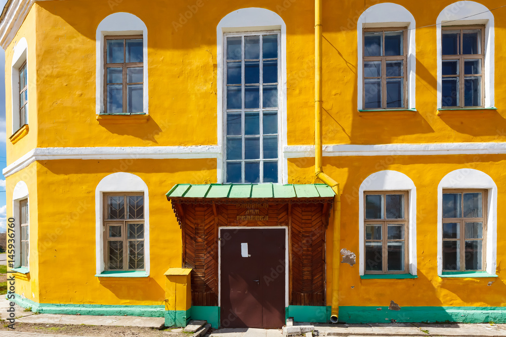 Yellow building of crafts Kostyukovichi Belarus